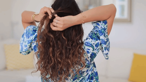 knot hairstyle for frizzy hair