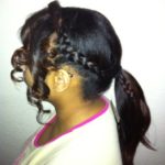 Side braid detail ponytail with curly leave out at the front