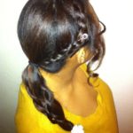 Side braid detail with white flower clip on ponytail