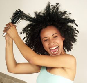 afro-american-woman-detangling-hair-2