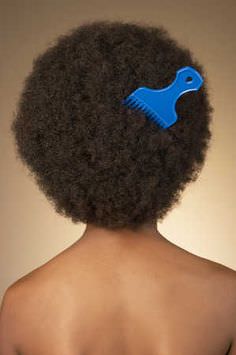 Afro with an afro pick