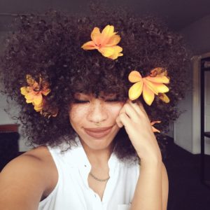 Would You Rock It? The ‘Floral Fro’ Is A Trend That’s Here To Stay