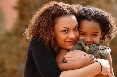 African american woman and child both with curly natual hair