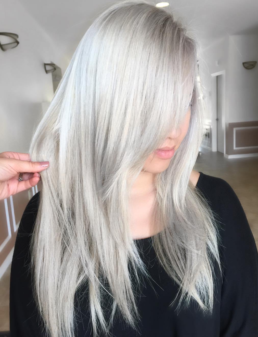 Silver Blonde Layered Straight Hairstyle