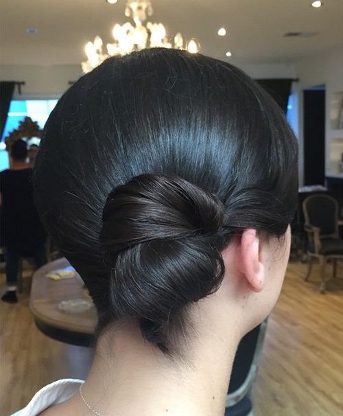 formal polished low side bun for medium hair