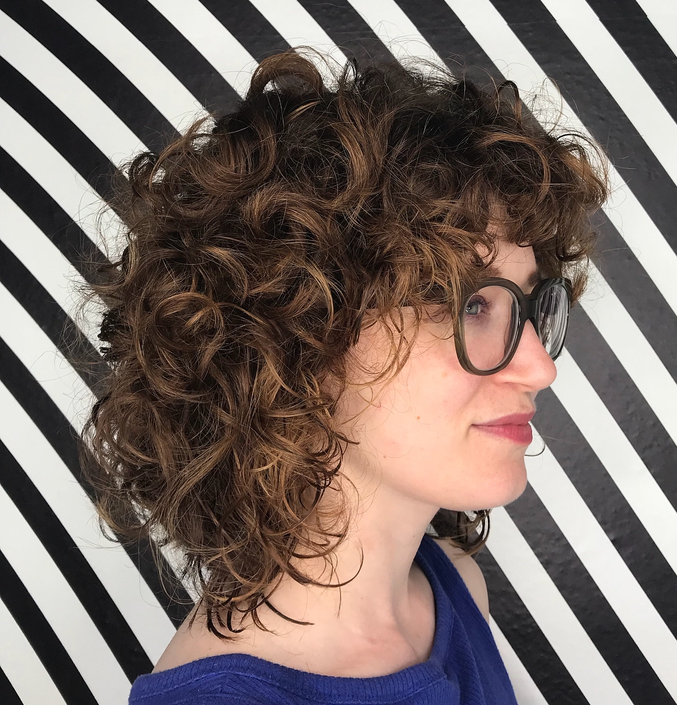 Mid-Length Curly Hairstyle With Bangs