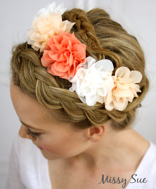 braided updo with hair flowers