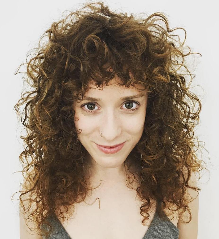 Curly Layered Hairstyle With Bangs