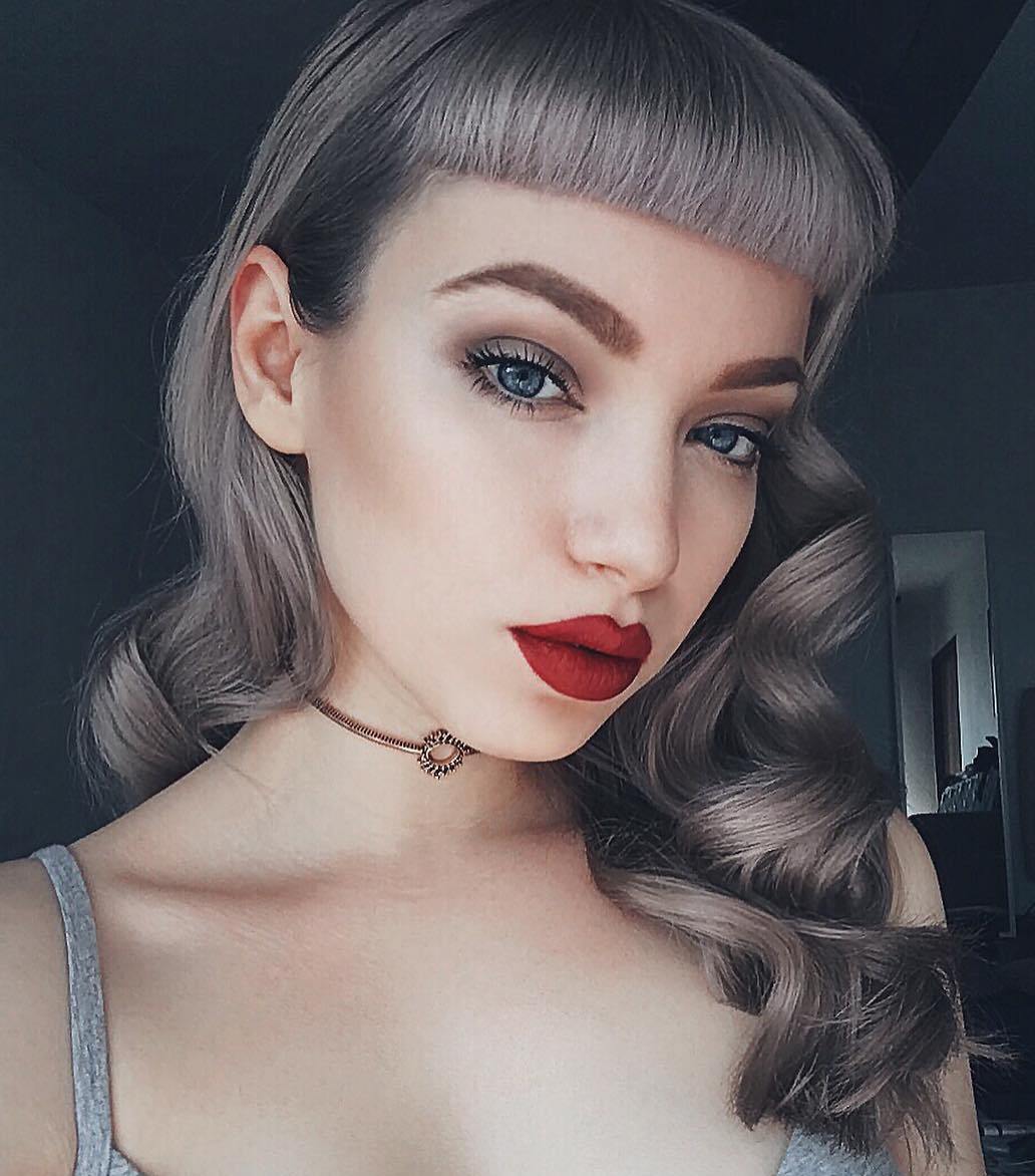 Curly Gray Pin Up Hairstyle With Bangs