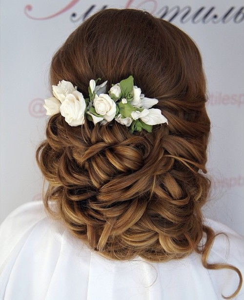 curly wedding updo with flowers for long hair