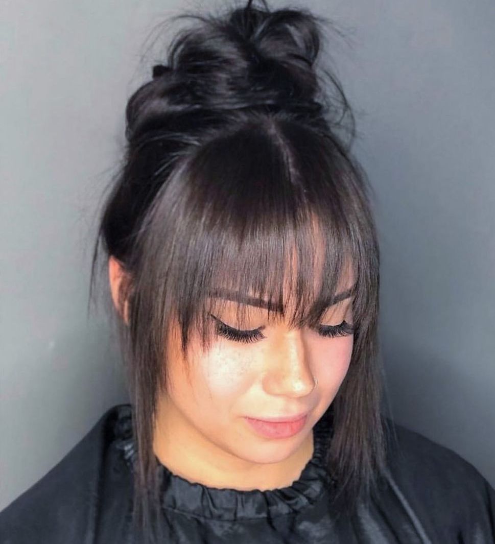 Messy Bun with Bangs and Face Framing Pieces