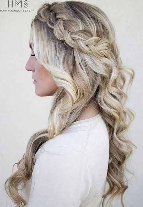 blonde curly hairstyle with a Dutch crown braid