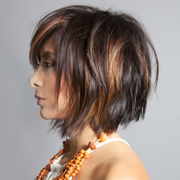 messy brunette bob with copper balayage