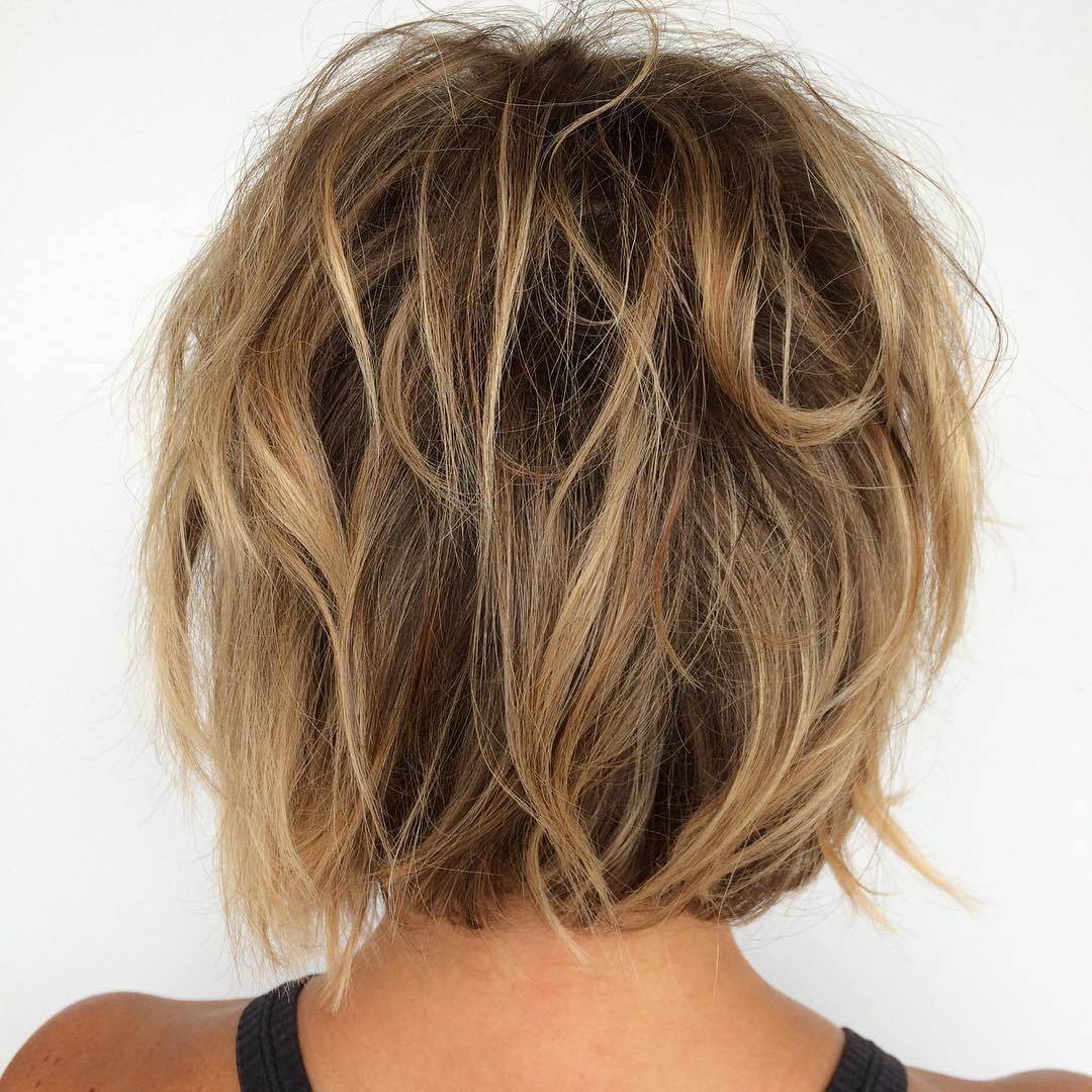 brown messy bob with blonde and caramel highlights