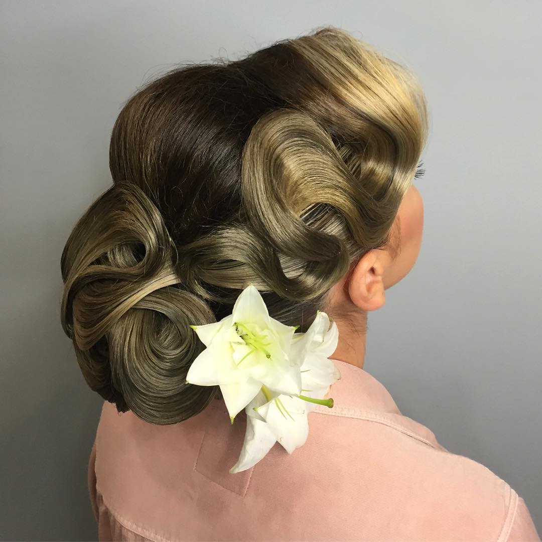 Wavy Chignon Updo With A Flower