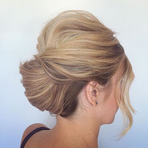 low french twist updo with a bouffant and bangs
