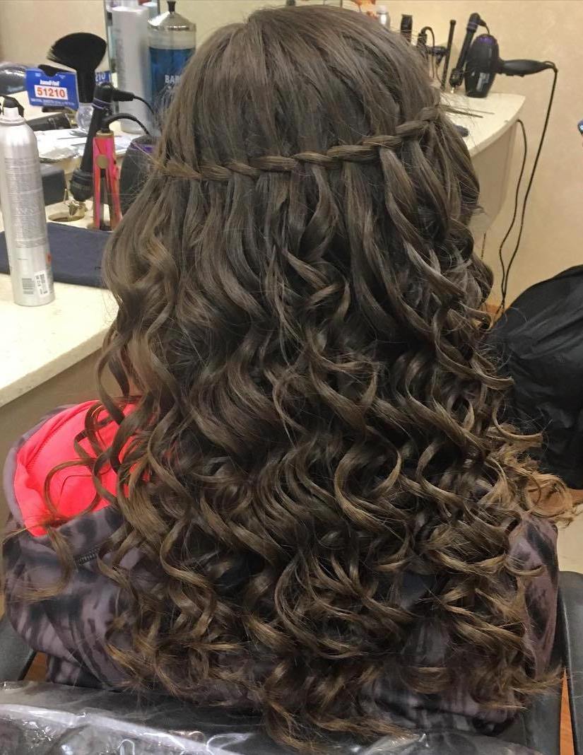 long curly hairstyle with a thin waterfall braid