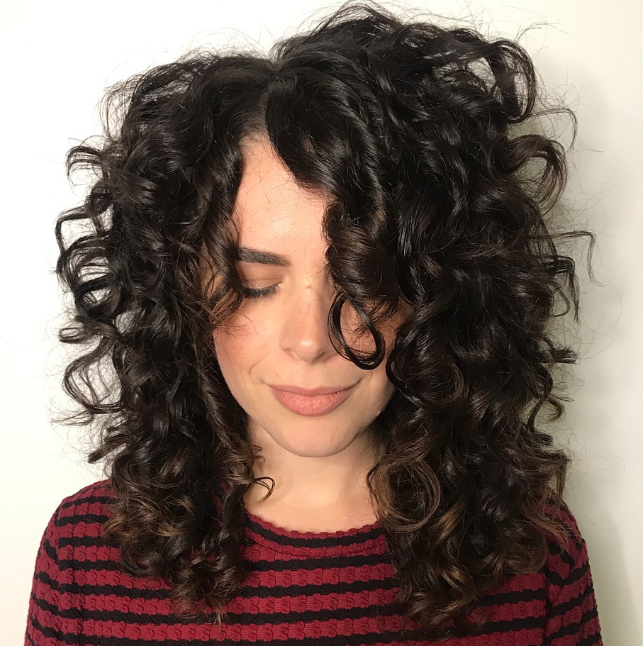 Mid-Length Curly Hairstyle with Off-Centre Part