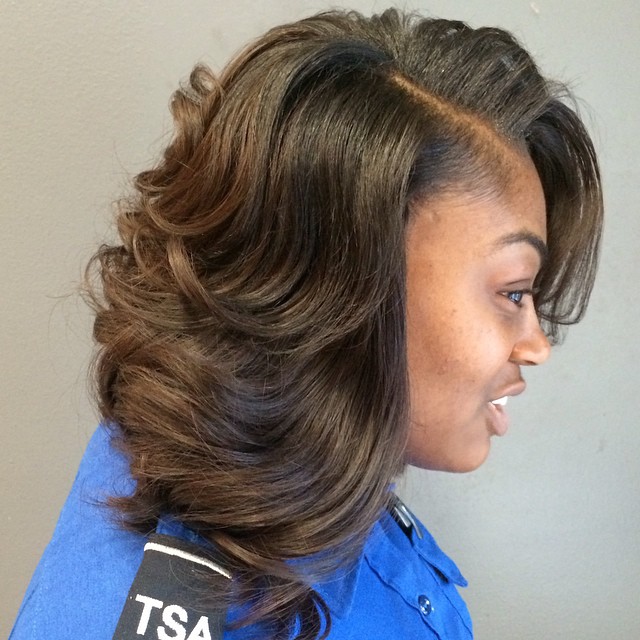 brown layered sew in hairstyle