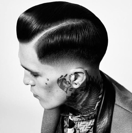 sleek side-parted boys hairstyle