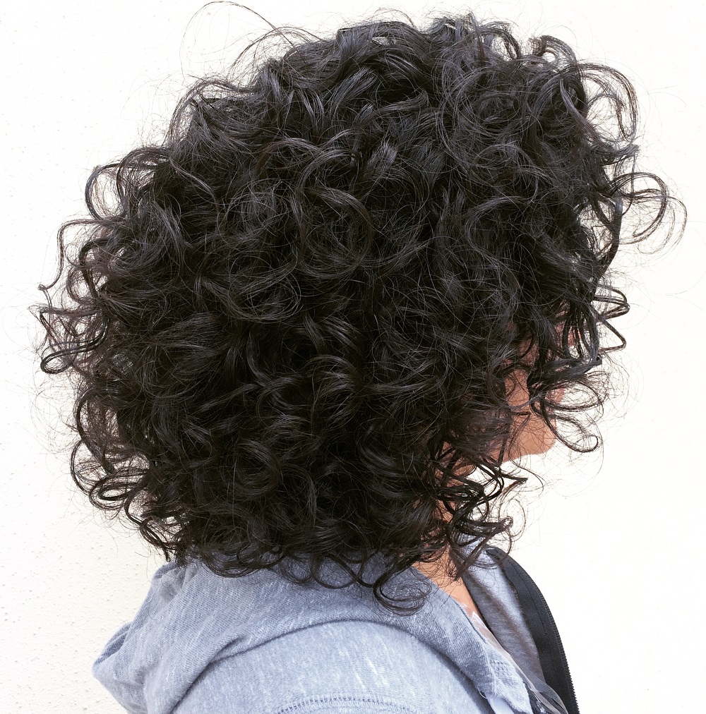 Voluminous Layered Hairstyle For Curly Hair