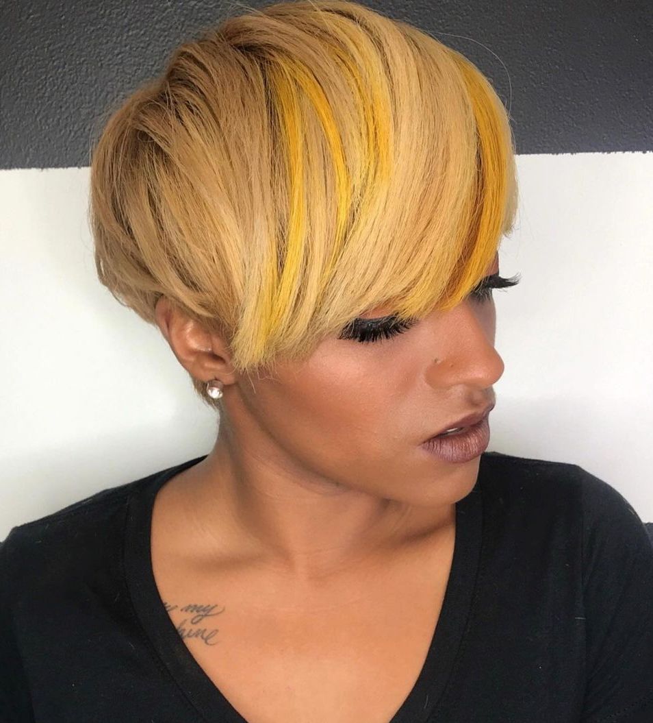 Golden Blonde Pixie with Long Bangs and Yellow Highlights