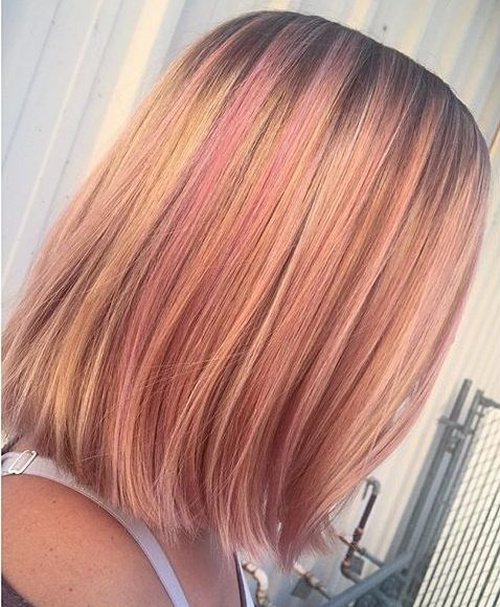 strawberry blonde bob with pastel pink highlights