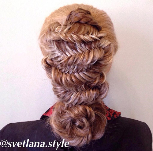 fancy fishtail hairstyle with braided flower