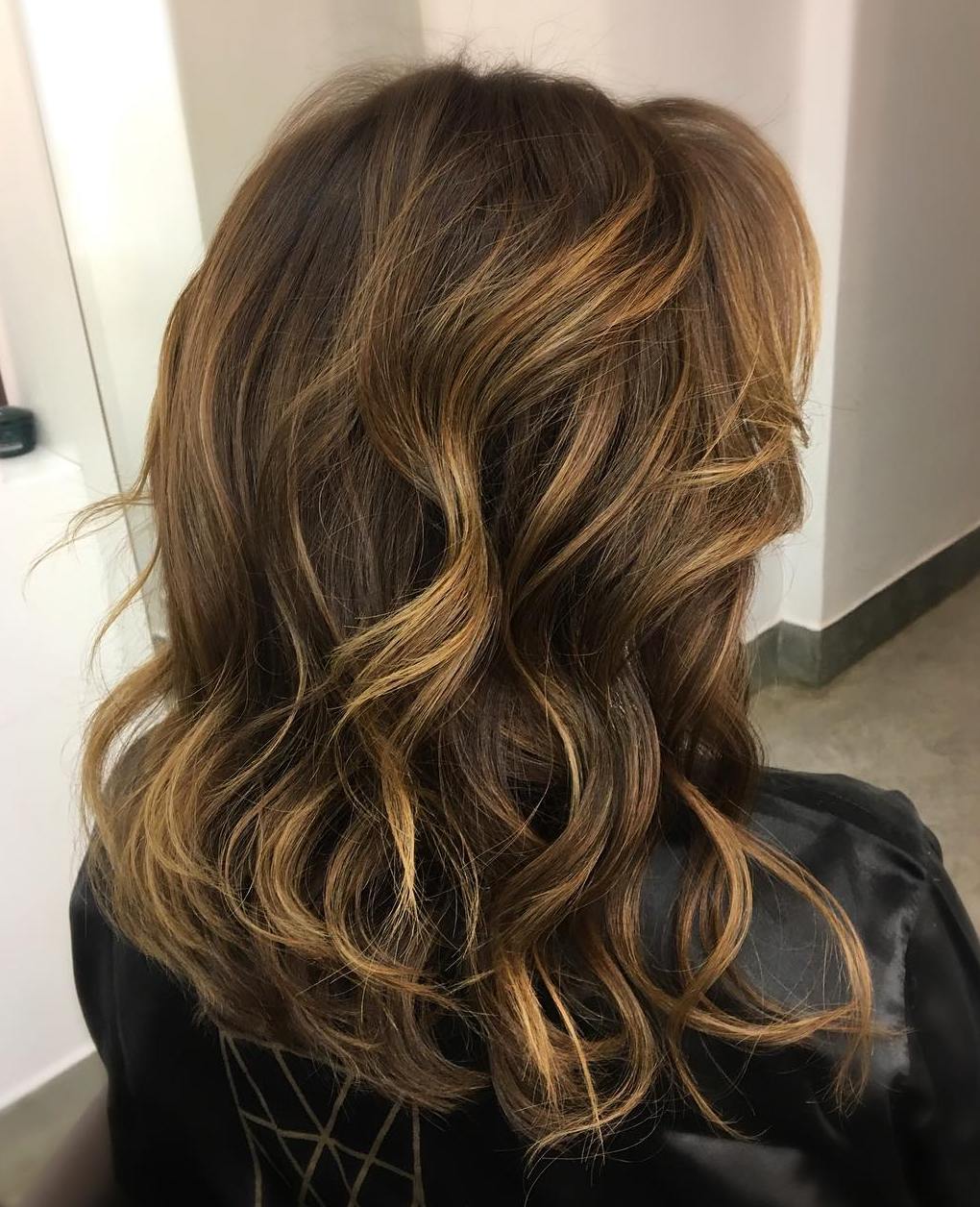 dark brown hair with light brown and blonde highlights