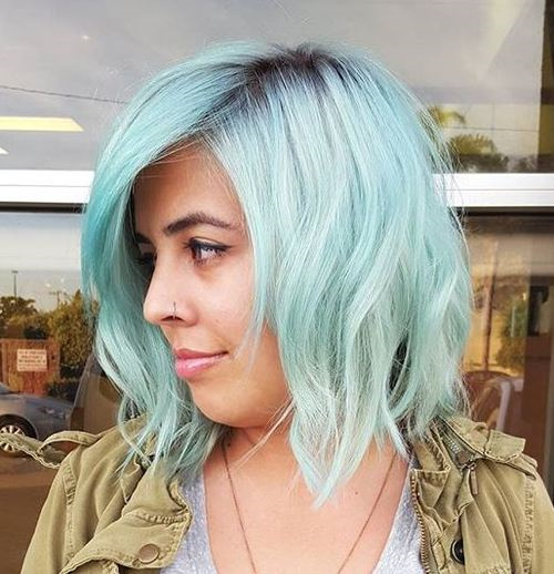 pastel blue hair with dark roots