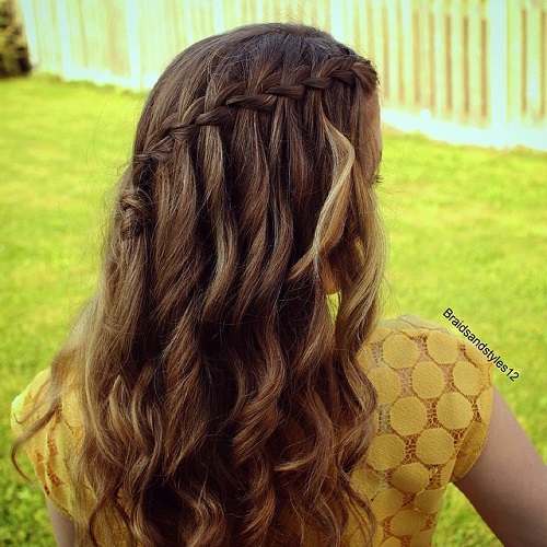 curly half up waterfall braid hairstyle