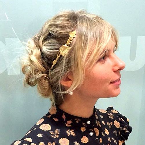 twisted updo with bangs for medium hair