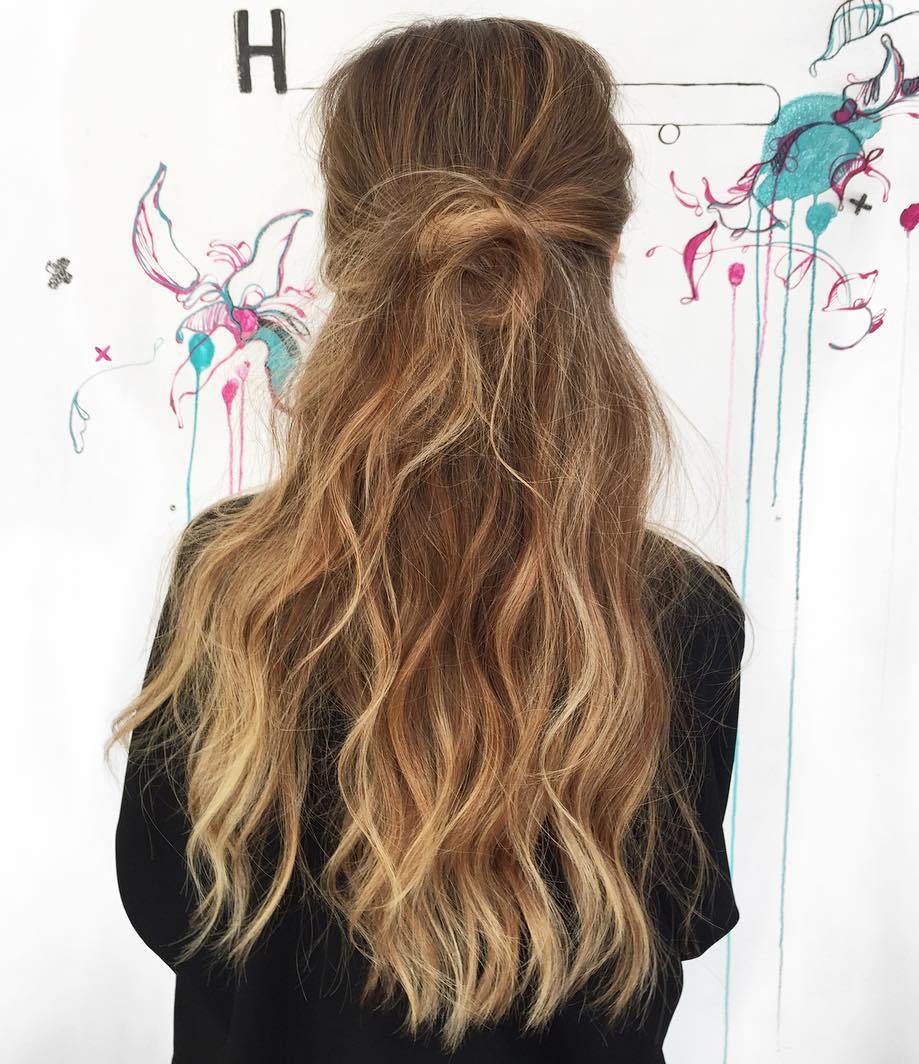Messy Half Updo For Long Wavy Hair
