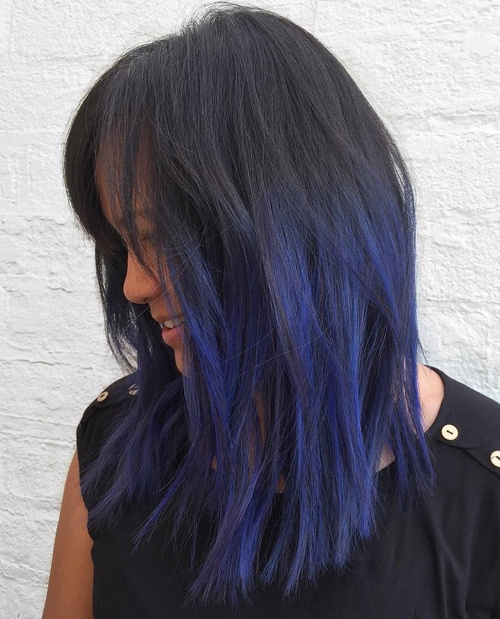 medium layered black hair with blue highlights