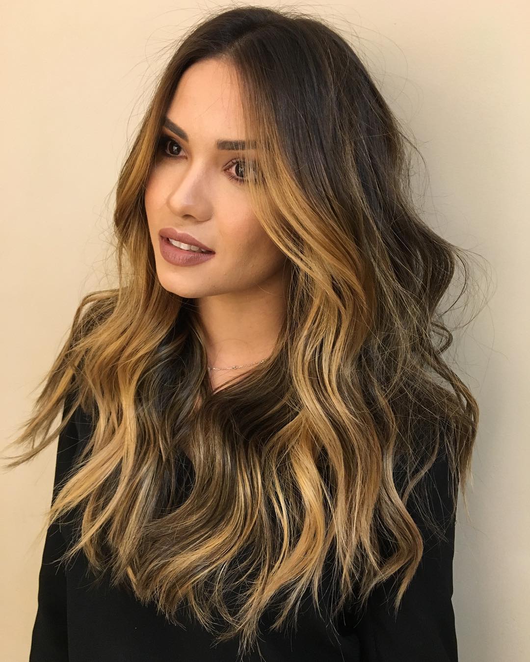 layered brown hair with golden brown highlights