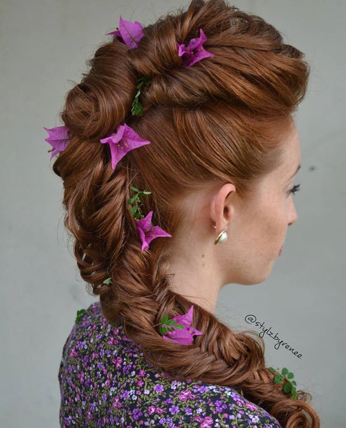 formal fishtail hairstyle with hair flowers