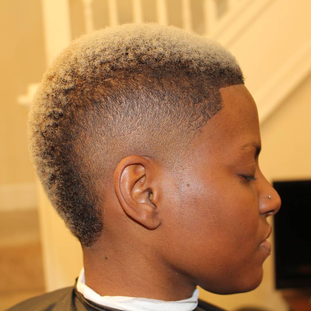 short blonde mohawk with faded sides