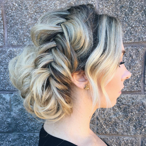 loose fishtailed updo with bangs