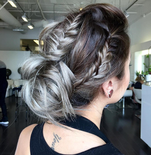 messy bun updo with three fishtails