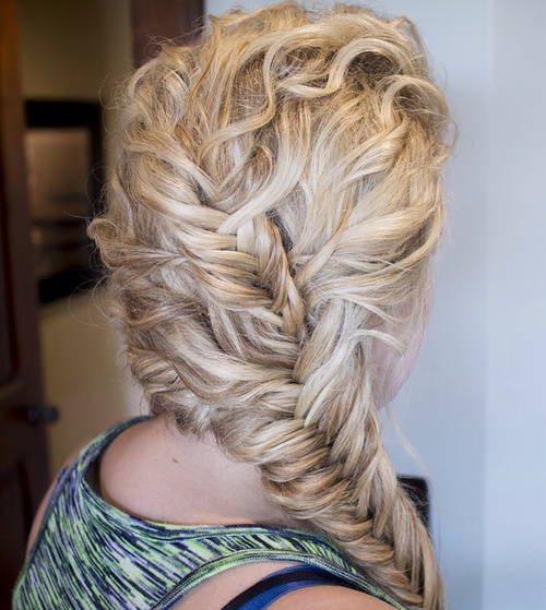 curly blonde hairstyle with two fishtails