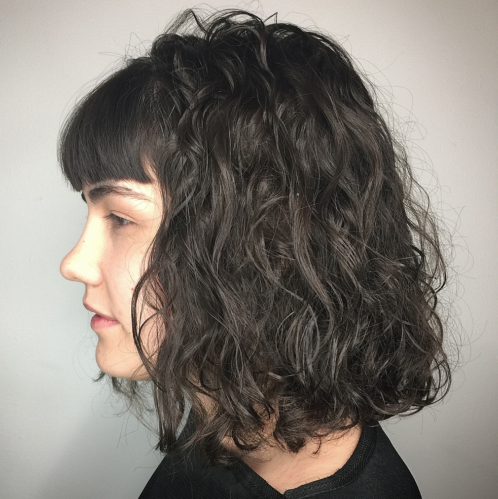 Long Perm Hairstyle With Thin Curls And Short Bangs