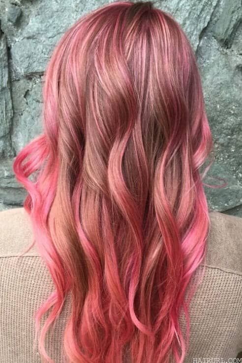 full head pink highlights on long wavy hair