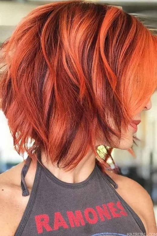 copper highlights on red wavy hair