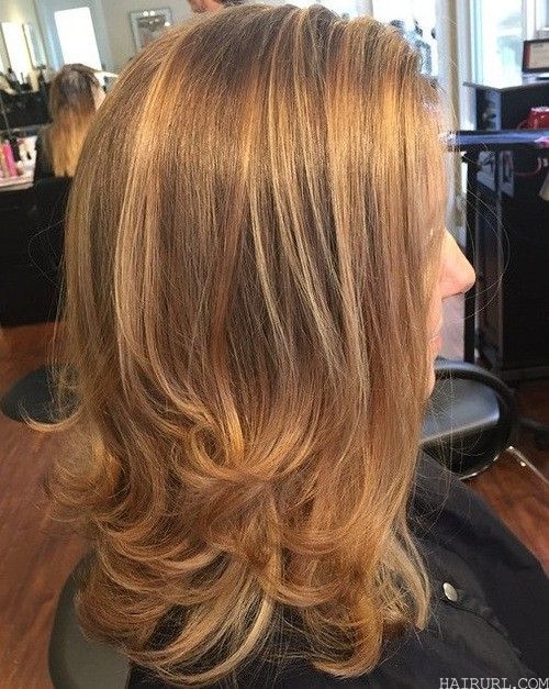 Reddish blonde lowlights haircut for women 