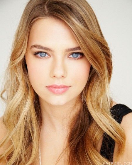 Soft Curls Blonde hairstyle for women with blue eyes