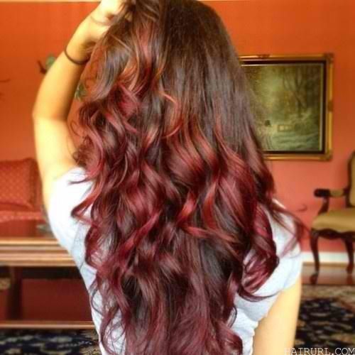 asymmetrical red highlights on brown hair for cute girl