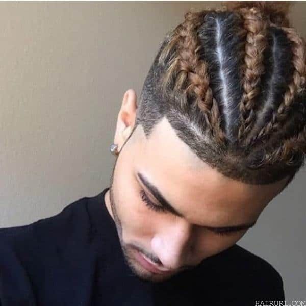 taper fade hairstyle with four braids