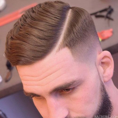 fade haircut with side part for men