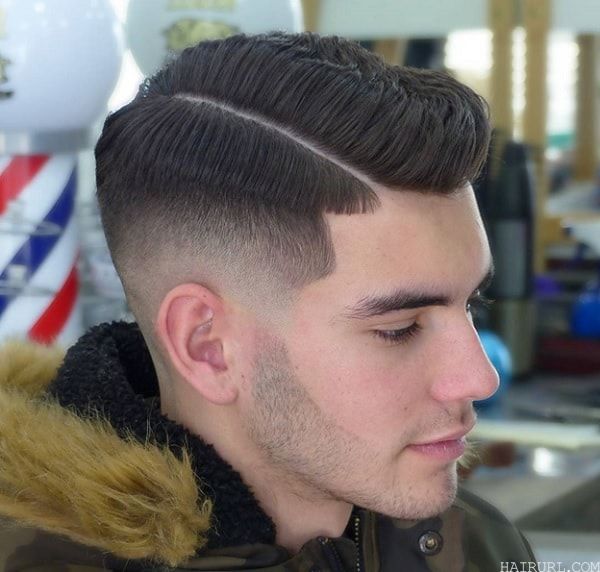 mid fade haircut with a part