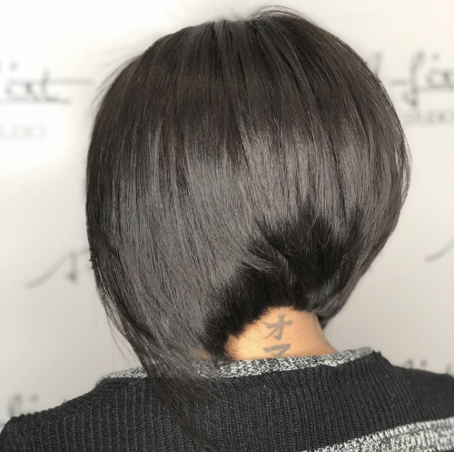 Woman with a graduated bob haircut, one of the different types of bobs.